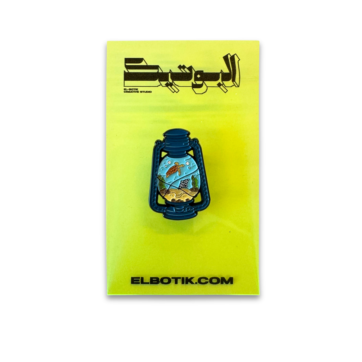 Fanar lantern pin on backing card