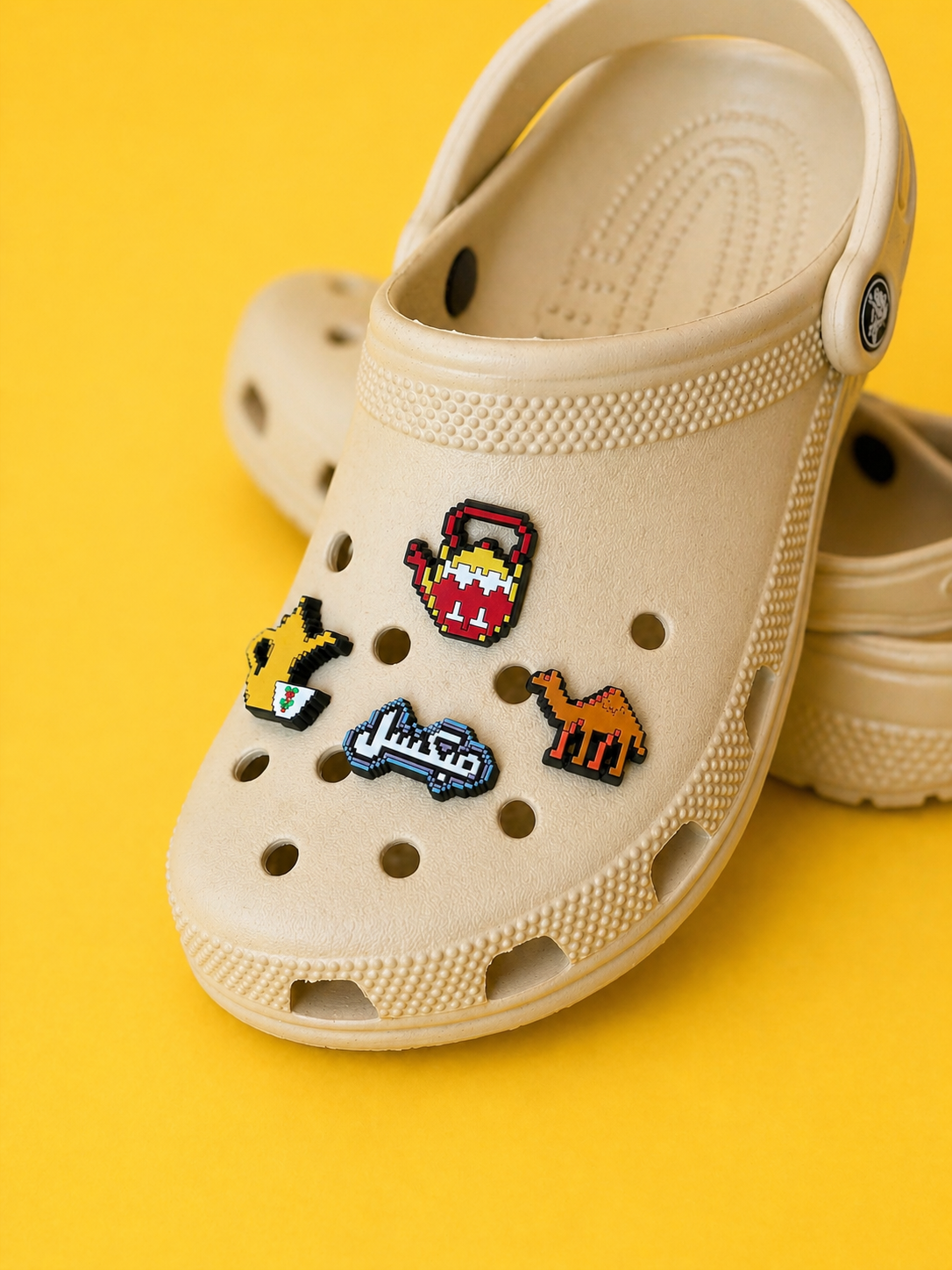 Pixel Habibi shoe charms fitted to clogs