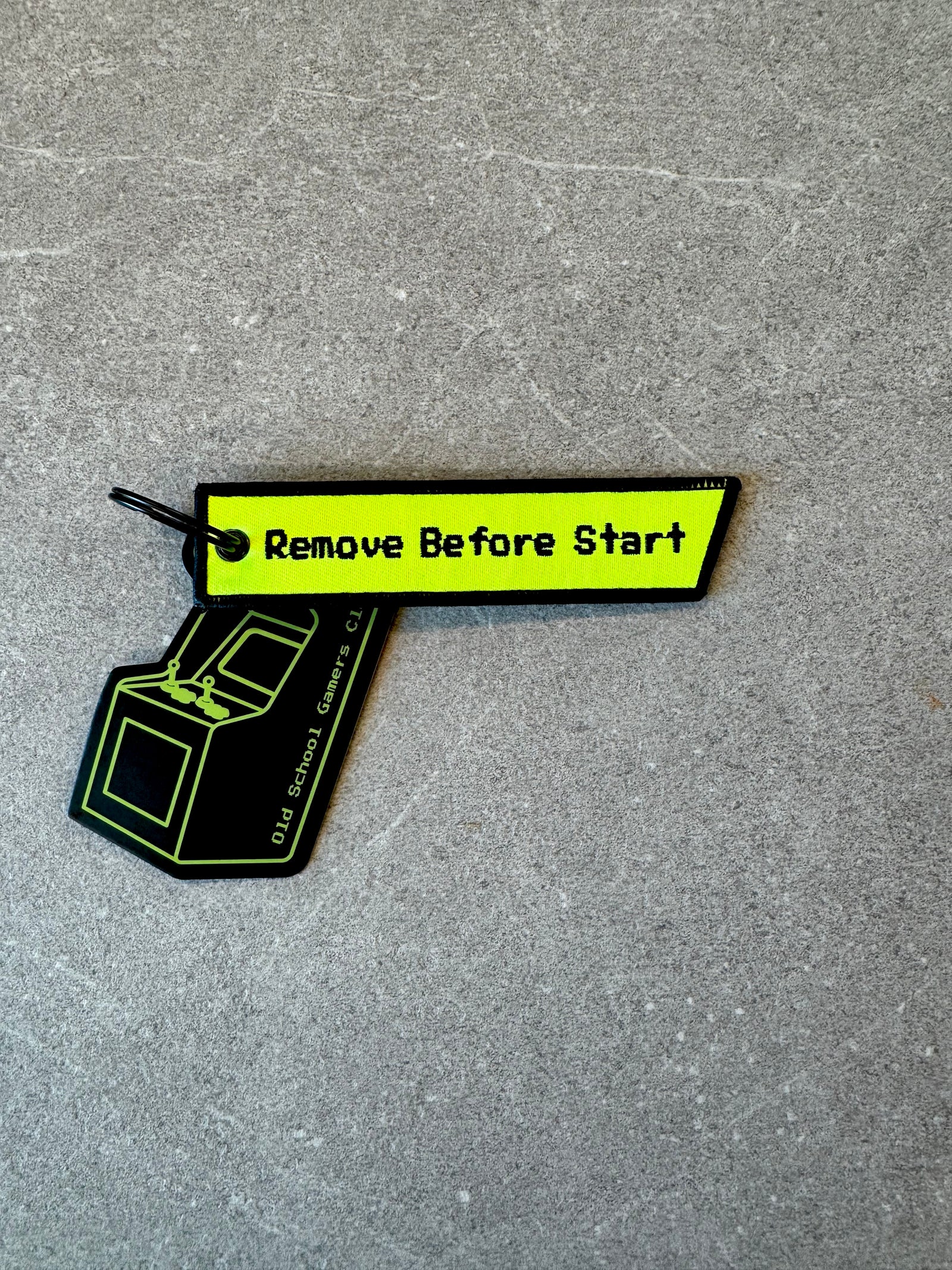 Remove Before Start keychain, close-up