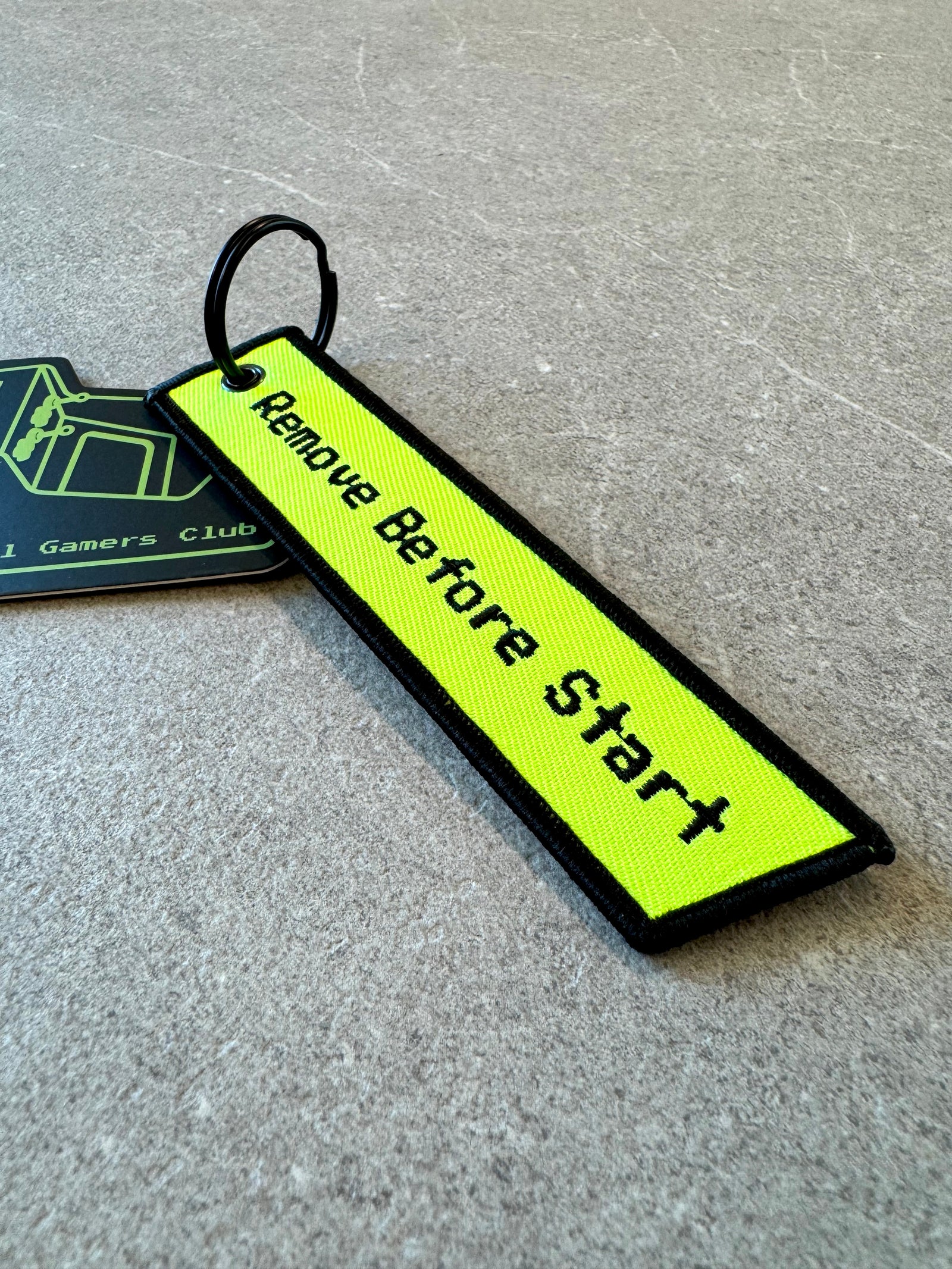 Remove Before Start keychain in neon green and red