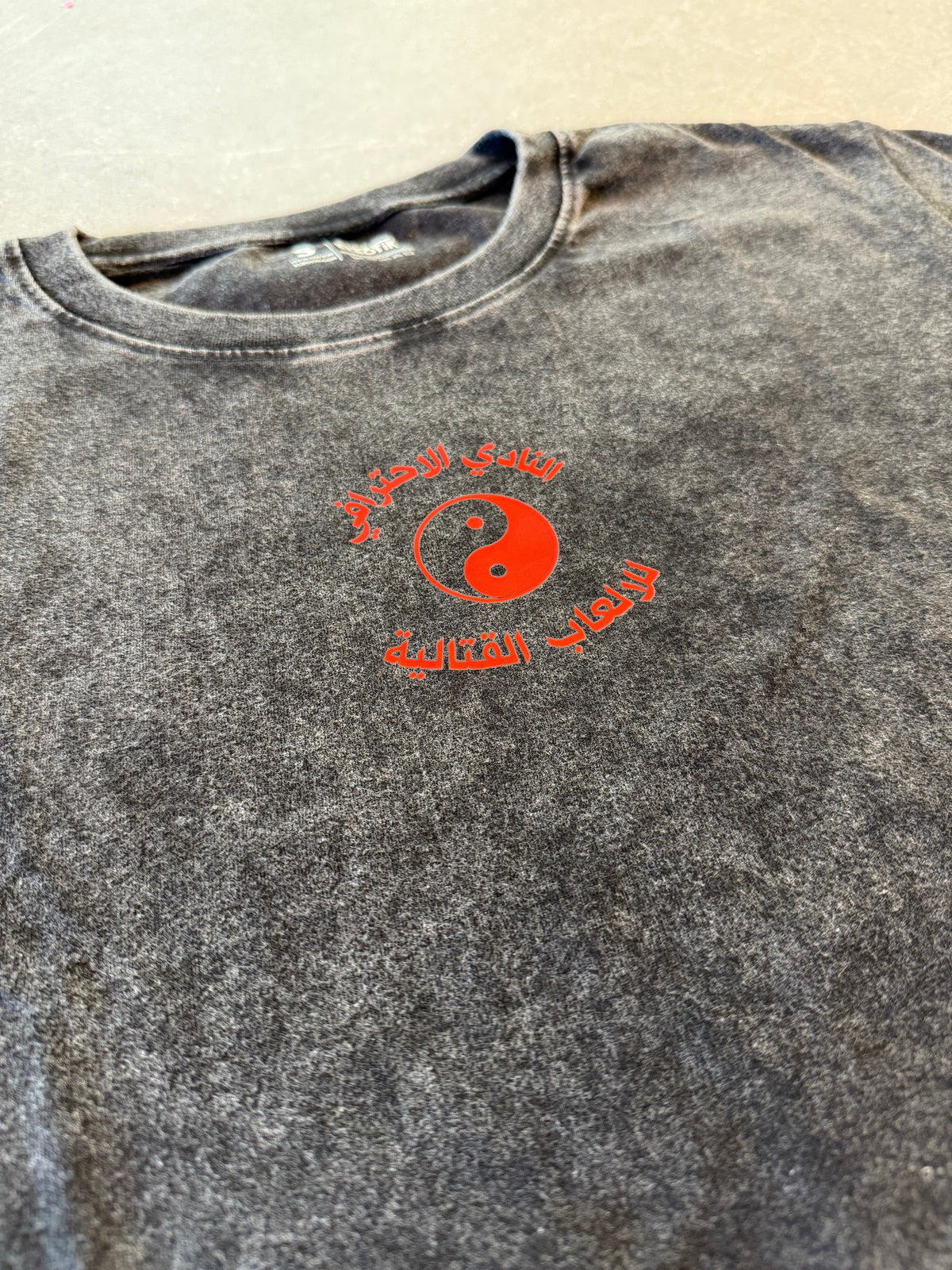 Arabic fighting game tee, front view