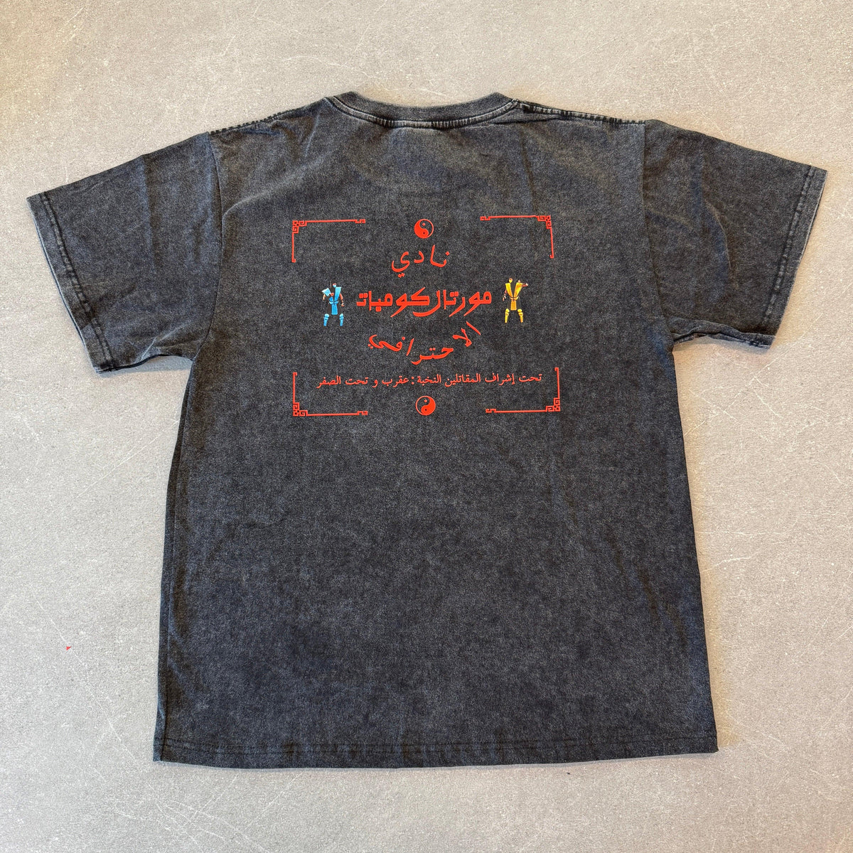 Arabic fighting game tee, pixel graphic close-up