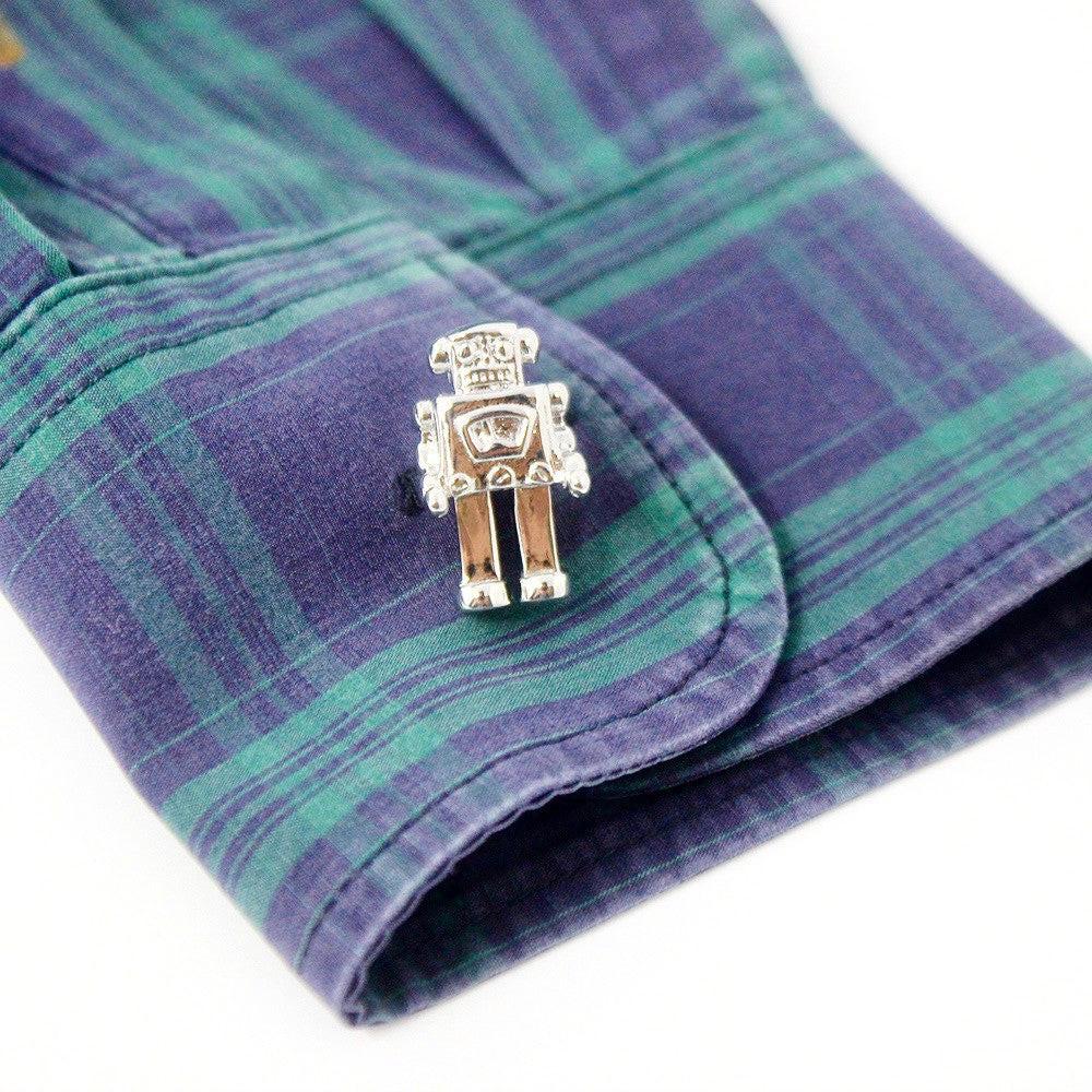 Robot cufflinks on a shirt cuff