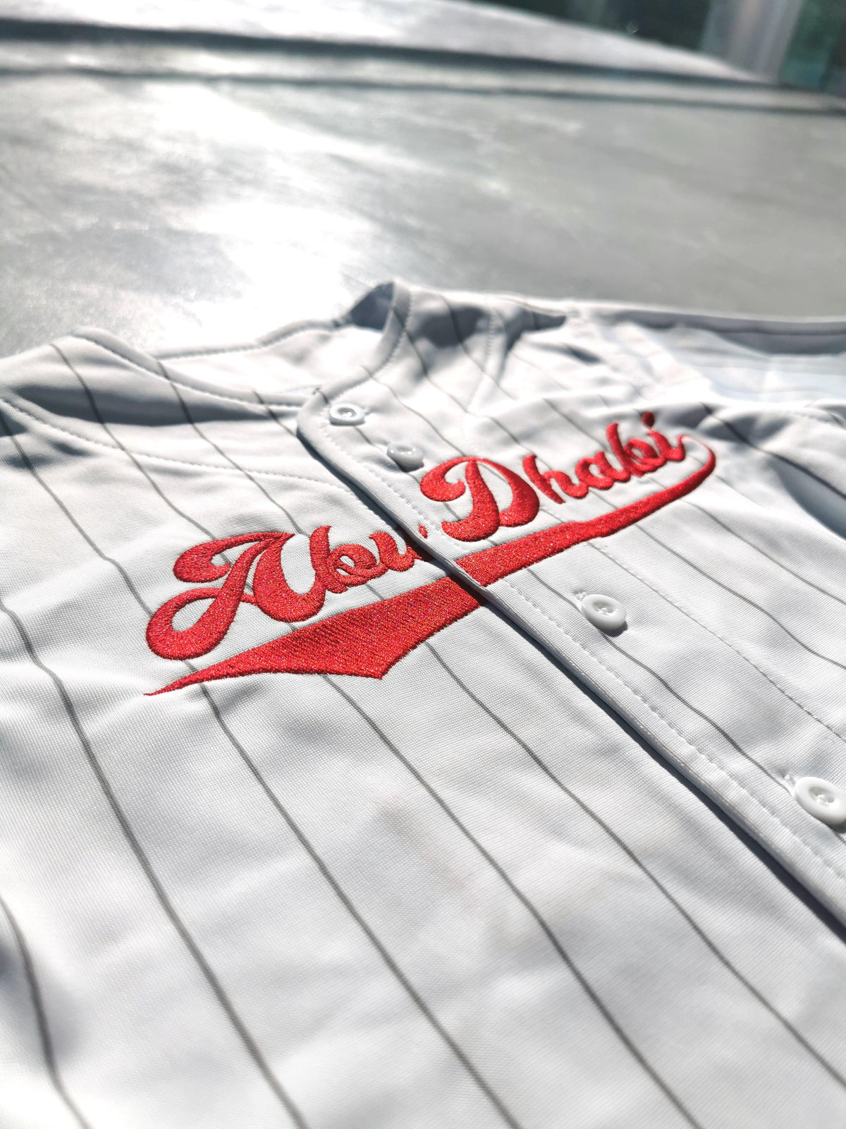 Abu Dhabi All-Stars kids jersey, tackle twill logo close-up