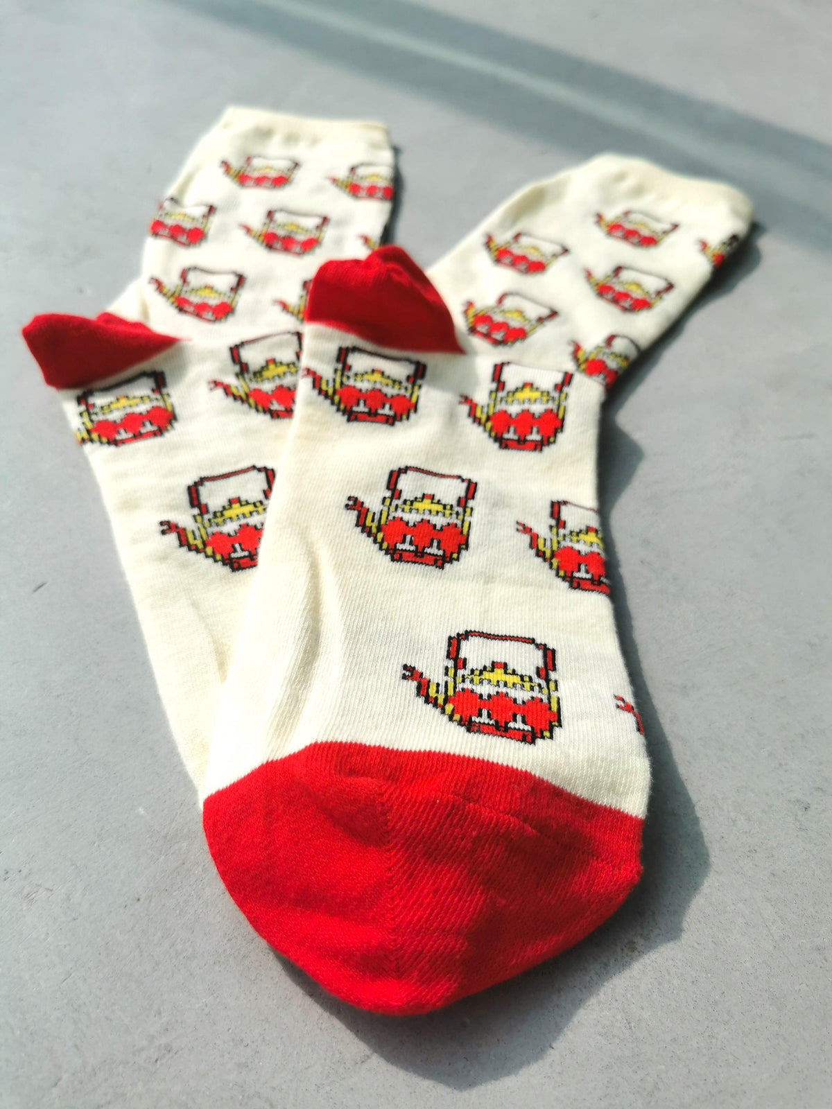 Pixelated teapot socks worn