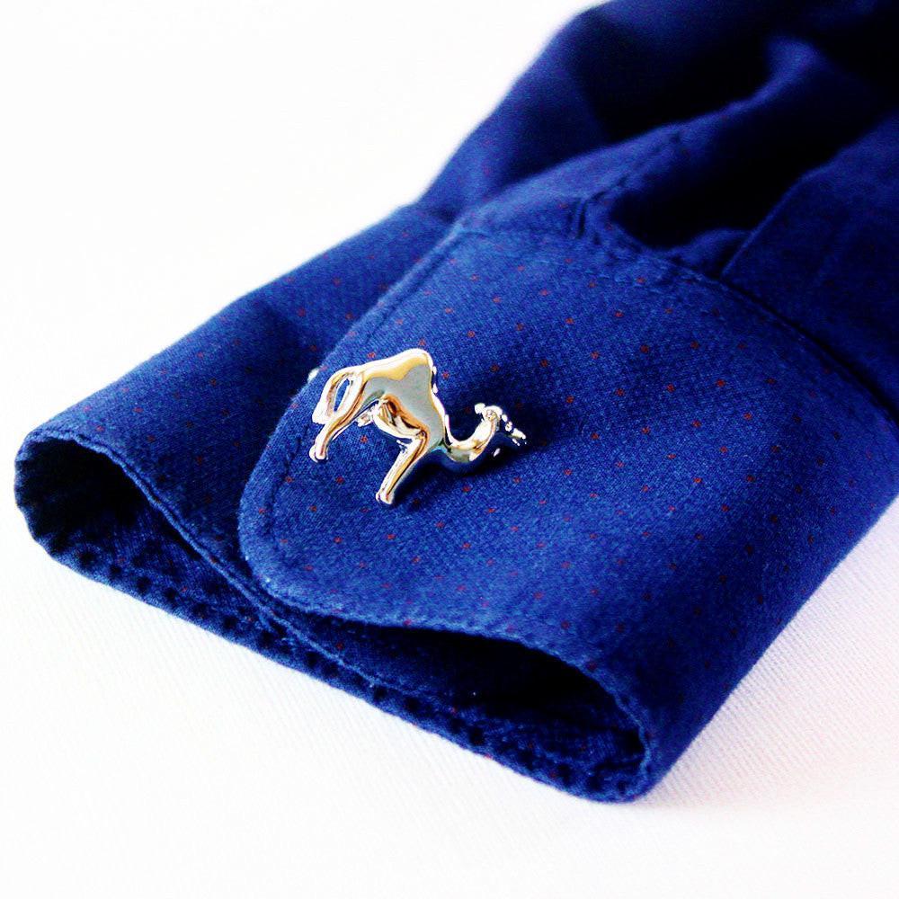 Camel cufflinks on a shirt cuff