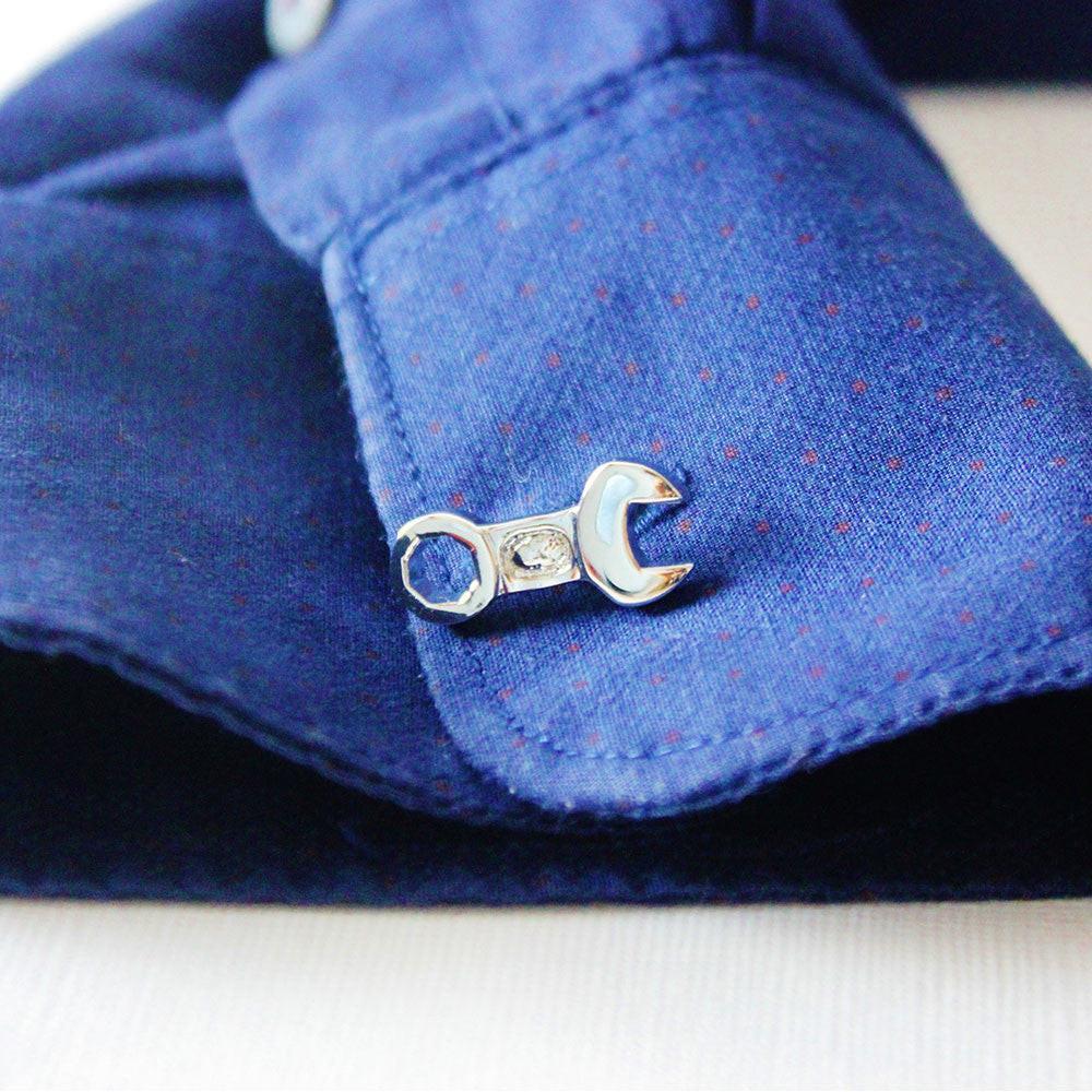 Tools cufflinks on a shirt cuff