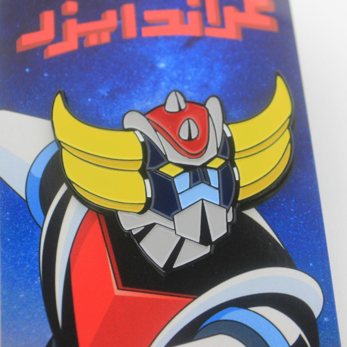 Retro robot enamel pin, close-up